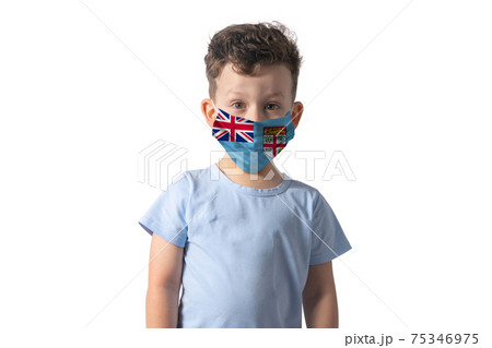 Respirator with flag of Fiji. White boy puts on medical face mask isolated on white background 75346975