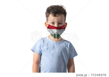 Respirator with flag of Hungary. White boy puts on medical face mask isolated on white background 75346976