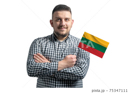 White guy holding a flag of Lithuania smiling confident with crossed arms isolated on a white background 75347111
