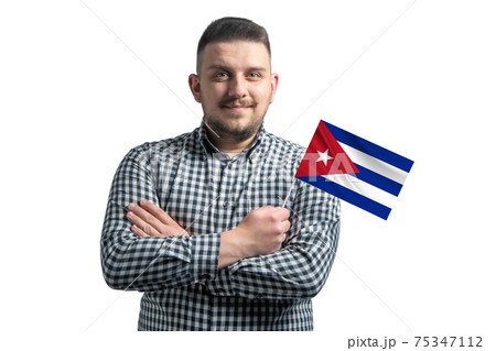 White guy holding a flag of Cuba smiling confident with crossed arms isolated on a white background White guy holding a flag of Cuba smiling confident with crossed arms isolated on a white background 75347112