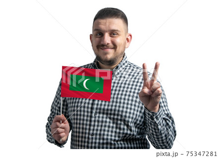 White guy holding a flag of Maldives and shows two fingers isolated on a white background 75347281