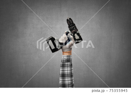 hand holds a construction tool battery (accumulator) drill - perforator 75355945