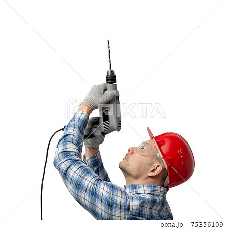 worker handyman or builder worked with construction tools - electric drill 75356109