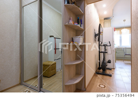 Fragment of the interior of the hallway and living room in the apartment 75356494