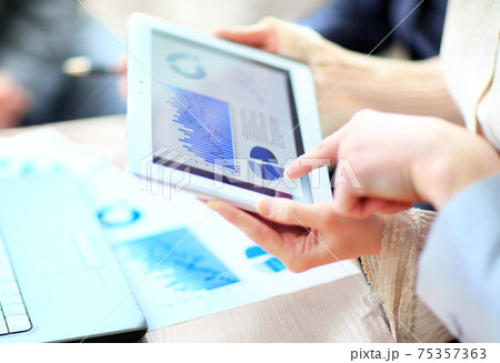 Business people meeting to discuss the situation on the market Business people meeting to discuss the situation on the market 75357363