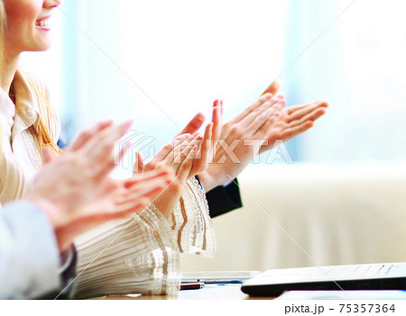 Photo of business partners hands applauding at meeting 75357364