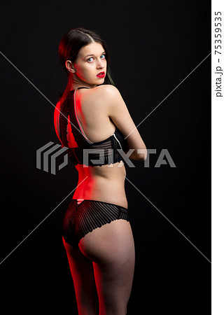 Vertical view photo beautiful shy lady in lace bikini boudoir bra panties. Tender skinny slim shape. Vertical view photo beautiful shy lady in lace bikini boudoir bra panties. Tender skinny slim shape. 75359535