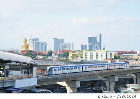 Train and Great Buddha at Wat Paknam in Bangkok 75361024