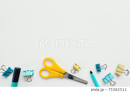 Clips, pencil, marker, scissors, white background. Work and education concept Clips, pencil, marker, scissors, white background. Work and education concept 75362511