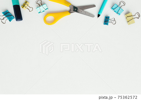 Clips, pencil, marker, scissors, white background. Work and education concept Clips, pencil, marker, scissors, white background. Work and education concept 75362572