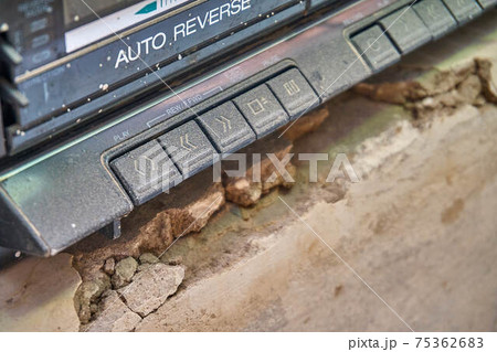 Dusty old cassette player extreme close view Dusty old cassette player extreme close view 75362683