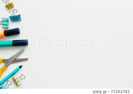 Clips, pencil, marker, scissors, white background. Work and education concept 75362783