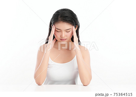 Young asian woman has headache, on white background, Health concept. 75364515