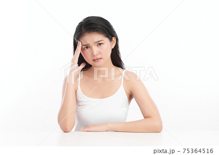 Young asian woman has headache, on white background, Health concept. 75364516