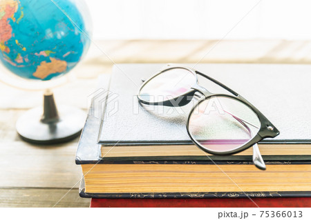 Reading glasses put on hardcover books Reading glasses put on hardcover books 75366013