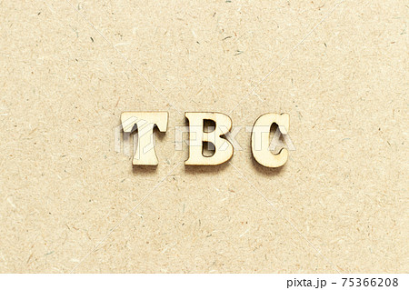 Alphabet letter in word TBC (Abbreviation of to be confirmed or continued) on wood background 75366208