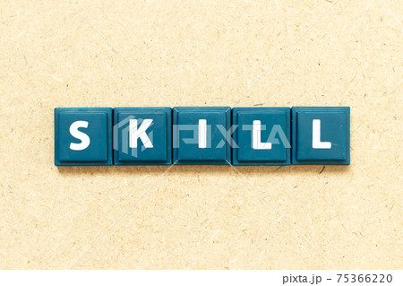 Tile alphabet letter in word skill on wood background Tile alphabet letter in word skill on wood background 75366220