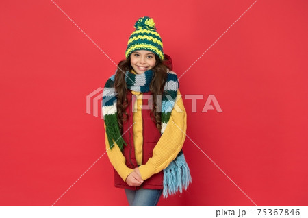 kid with happy face wearing warm winter clothing and kid with happy face wearing warm winter clothing and 75367846