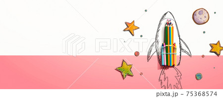 Back to school theme with a rocket and colored pencils 75368574