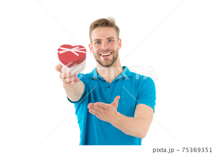 Happy man hold heart shaped valentine box. Guy smile 75369351