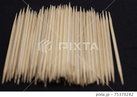bamboo created toothpick on black background bamboo created toothpick on black background 75370282