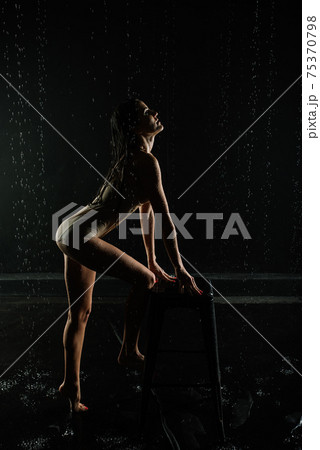 Young sexy woman posing in water studio. Young sexy woman posing in water studio. 75370798
