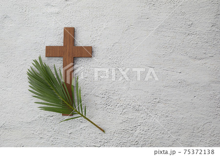Palm sunday background. Cross and palm on grey background. Palm sunday background. Cross and palm on grey background. 75372138