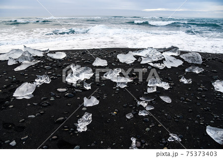 Icebergs on black volcanic beach, Iceland Icebergs on black volcanic beach, Iceland 75373403