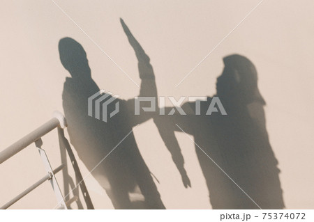 Elbow bumping safety greeting of coronavirus COVID-19. New normal. 75374072
