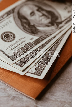 Money on home office desk, american dollars 75376857