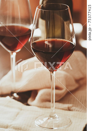 Traditional red house wine served in crystal glasses Traditional red house wine served in crystal glasses 75377415