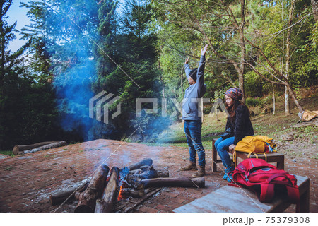Couple travel photograph nature on the mountains relax in the holiday. Romance lovers Camp Fire Couple travel photograph nature on the mountains relax in the holiday. Romance lovers Camp Fire 75379308