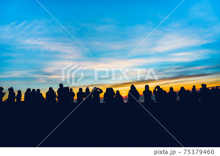 People travel nature. Travel relax. background silhouette People watching Sunrise and photographing People travel nature. Travel relax. background silhouette People watching Sunrise and photographing 75379460