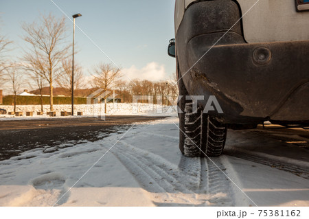 winter tires in the snow 75381162