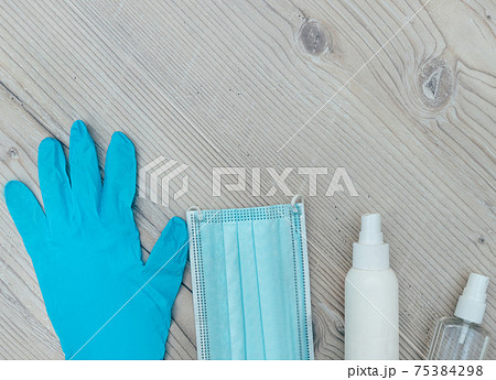 personal protective equipment on a wooden background 75384298
