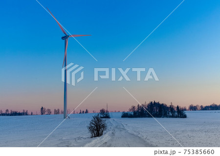 wind power plant at sunset in winter landscape wind power plant at sunset in winter landscape 75385660