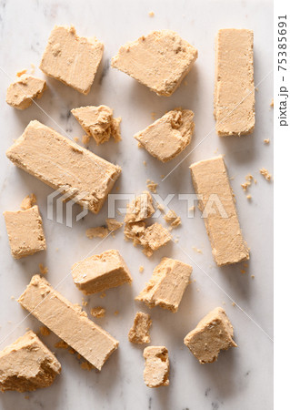 Sweet dessert halva prepared from peanut. 75385691
