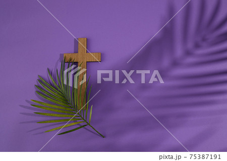 Palm sunday background. Cross and palm on purple background. Palm sunday background. Cross and palm on purple background. 75387191