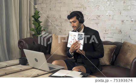 Portrait of smiling business, middle east CEO man working from home and talking to colleagues in webcam group video call conference on internet online on laptop computer notebook device in quarantine. Portrait of smiling business, middle east CEO man working from home and talking to colleagues in webcam group video call conference on internet online on laptop computer notebook device in quarantine. 75393674