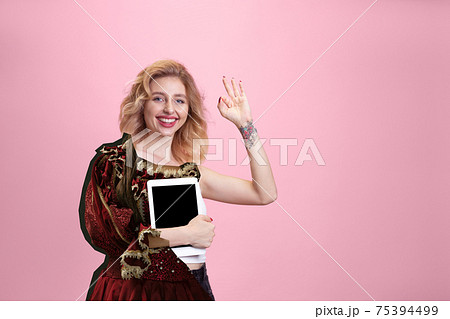 Magazine style collage with model outfit mixed of different eras. Copyspace. 75394499