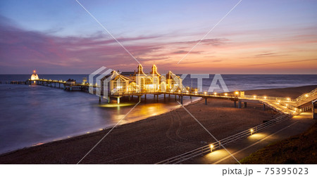 Panoramic view of pier in Sellin, Rugia (Ruegen) Baltic Coast island at purple sunrise, Germany. 75395023