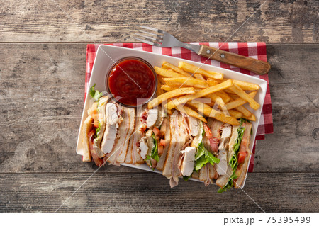 Club sandwich and French fries with ketchup sauce Club sandwich and French fries with ketchup sauce 75395499