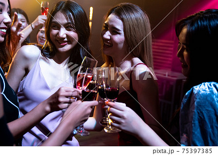 Young people celebrating a party, drink and dance 75397385