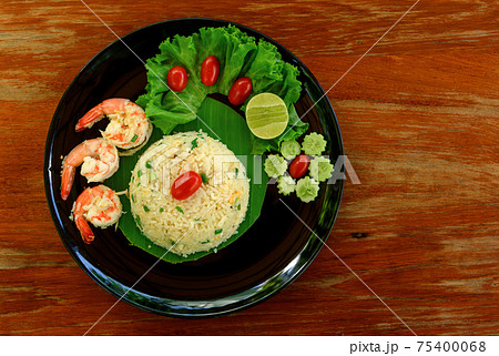 Top view of fried rice with shrimp on black dish Top view of fried rice with shrimp on black dish 75400068