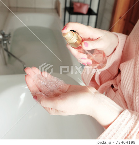 Closeup of person washing hands. Cleanliness and body care concept. Closeup of person washing hands. Cleanliness and body care concept. 75404199
