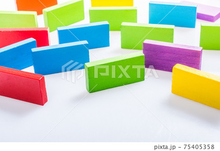 Colorful domino blocks on white background Colorful domino blocks on white background 75405358
