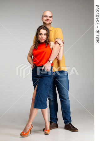 White young man and woman isolated on gray White young man and woman isolated on gray 75405563