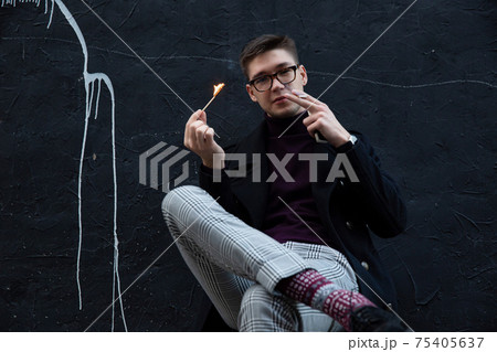 White european young man on black 75405637