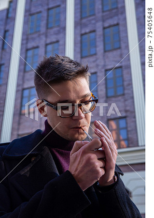 White european young man building behind White european young man building behind 75405648