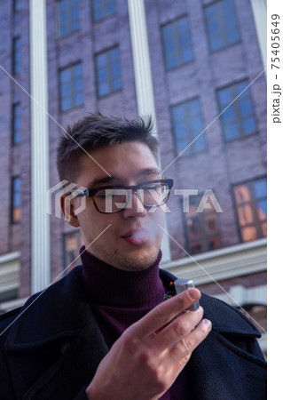 White european young man building behind White european young man building behind 75405649